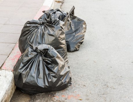 Enclosed and lockable skips positioned in a Blackheath residential area