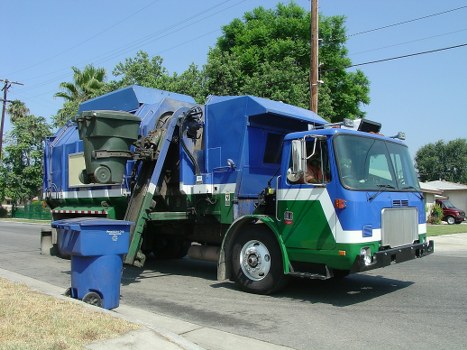 Waste removal trucks in action